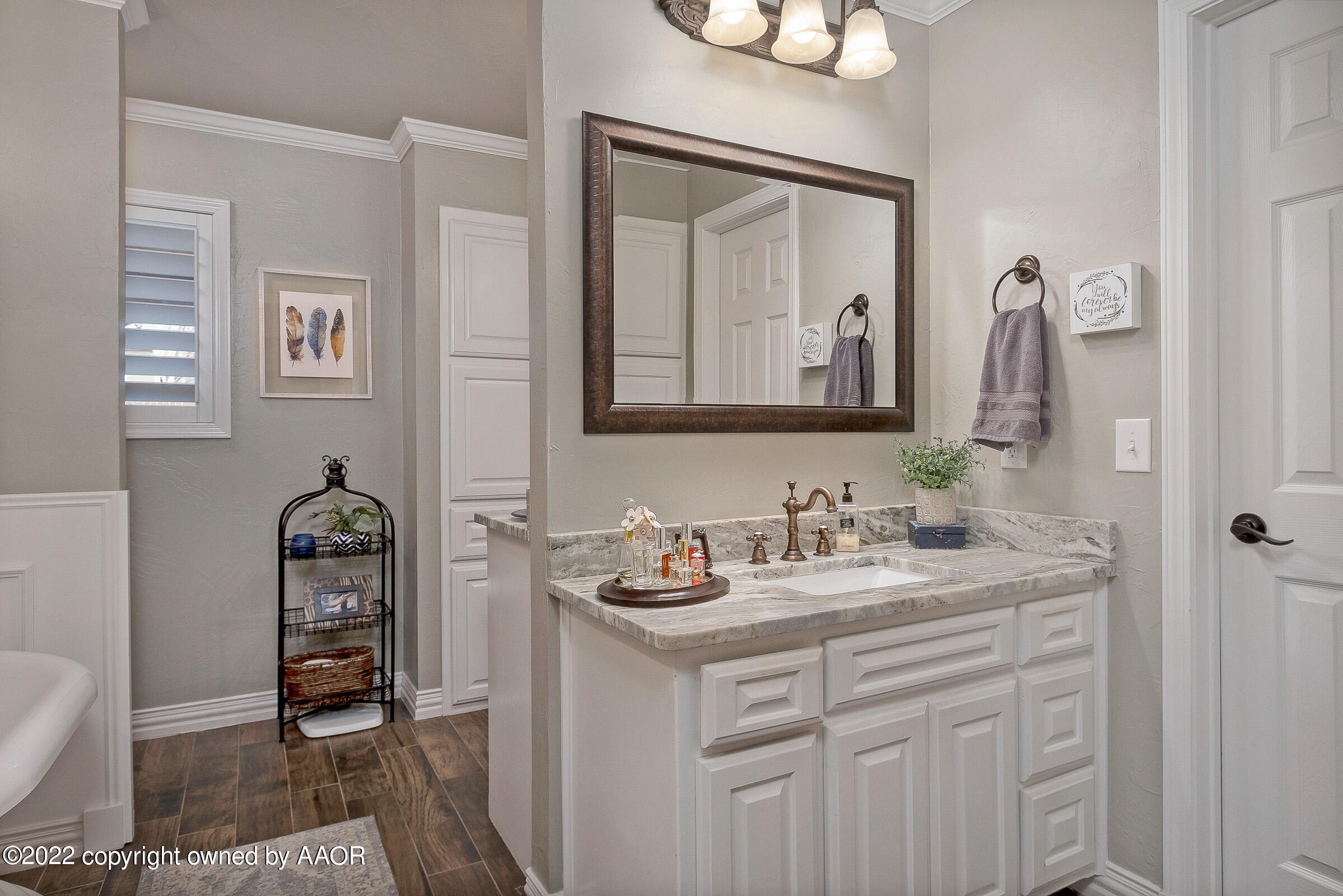 4223 Langtry Drive Amarillo, TX 79109 - Photo 14 of 56 a bathroom with a sink and a mirror