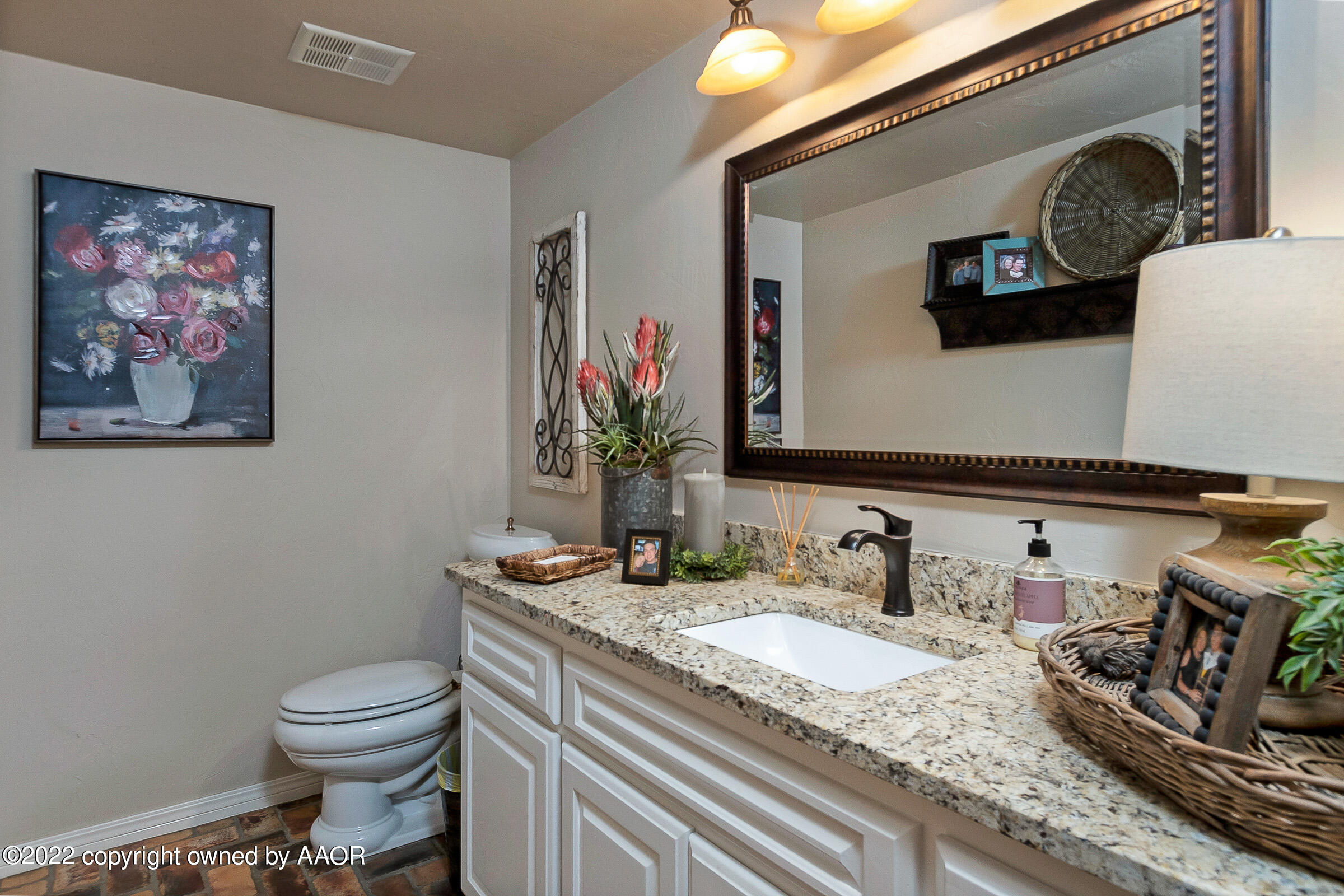 4223 Langtry Drive Amarillo, TX 79109 - Photo 19 of 56 a bathroom with a granite countertop sink and a mirror
