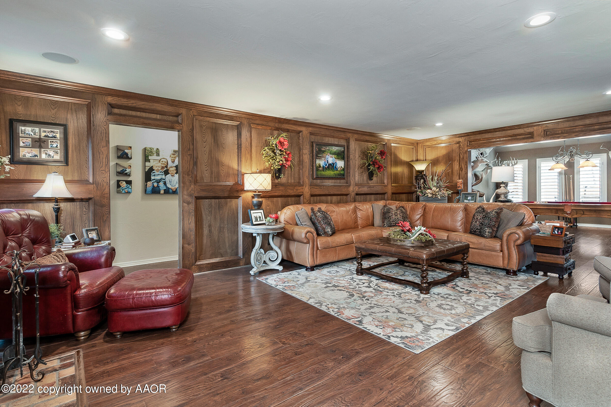 4223 Langtry Drive Amarillo, TX 79109 - Photo 21 of 56 a living room with furniture and wooden floor