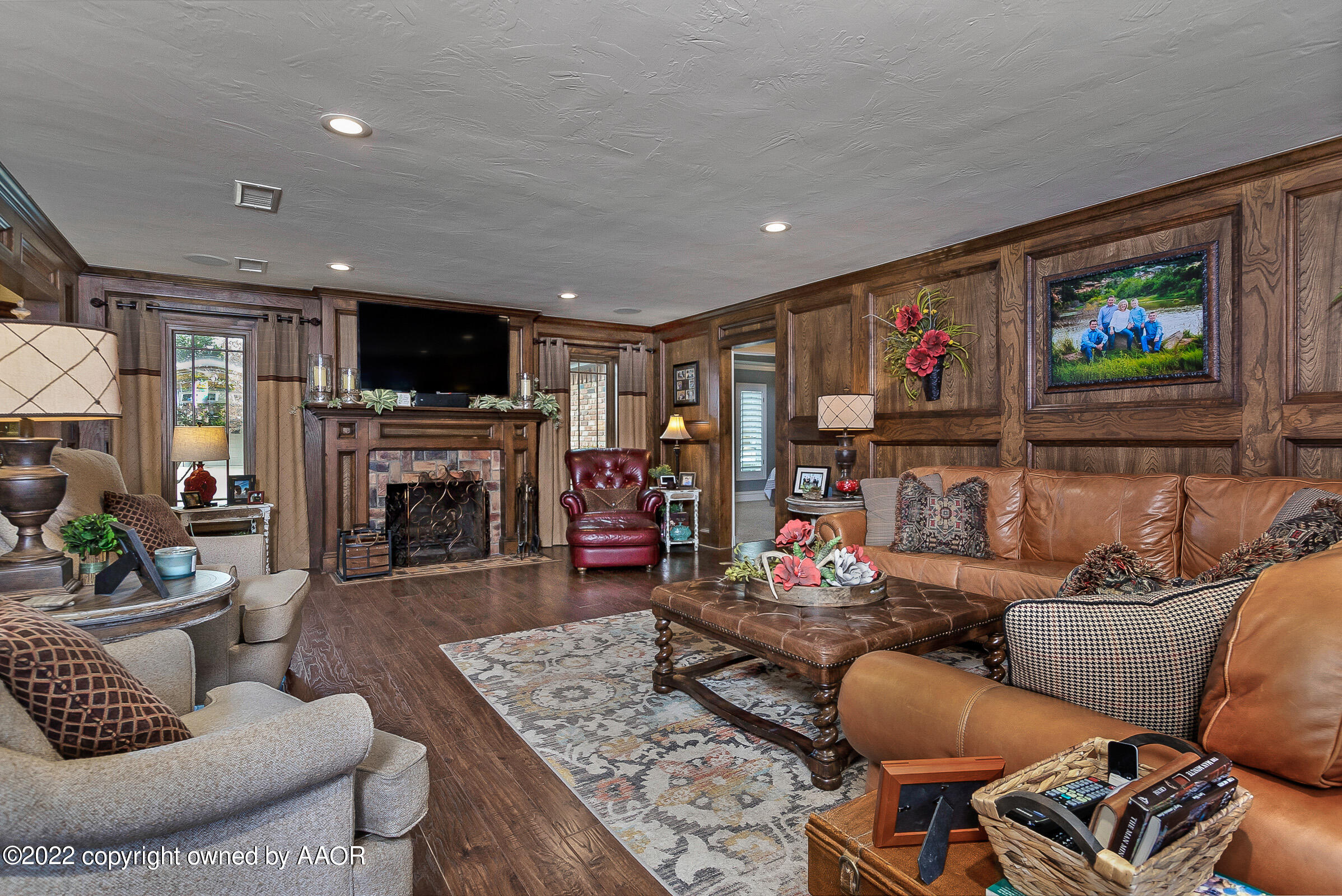 4223 Langtry Drive Amarillo, TX 79109 - Photo 22 of 56 a living room with furniture and a flat screen tv