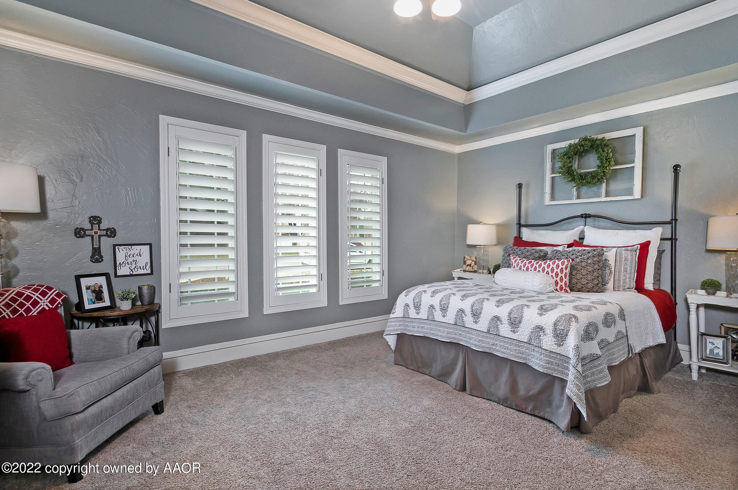 4223 Langtry Drive Amarillo, TX 79109 - Photo 27 of 56 a spacious bedroom with a bed a couch and a window