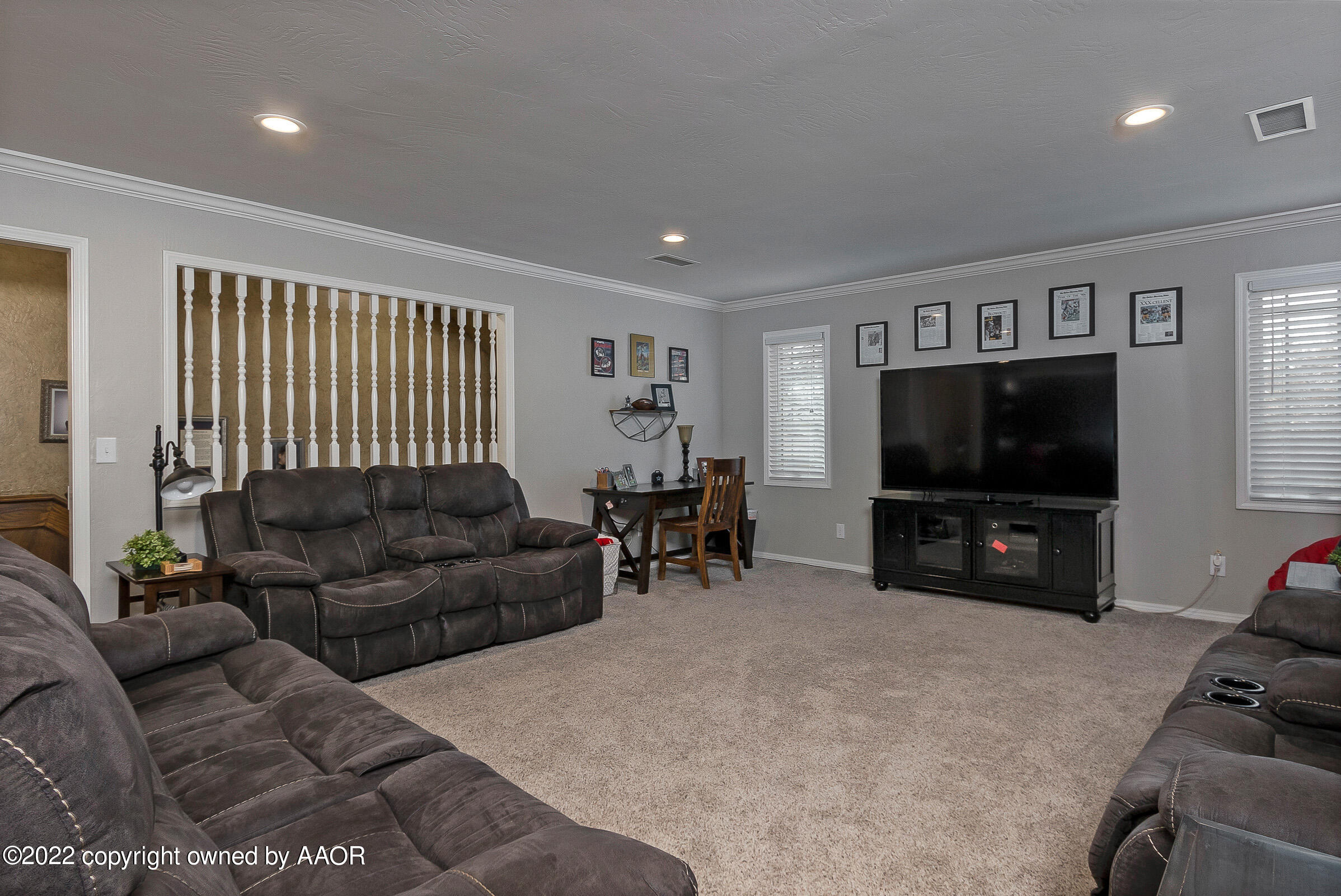 4223 Langtry Drive Amarillo, TX 79109 - Photo 35 of 56 a living room with furniture and a flat screen tv