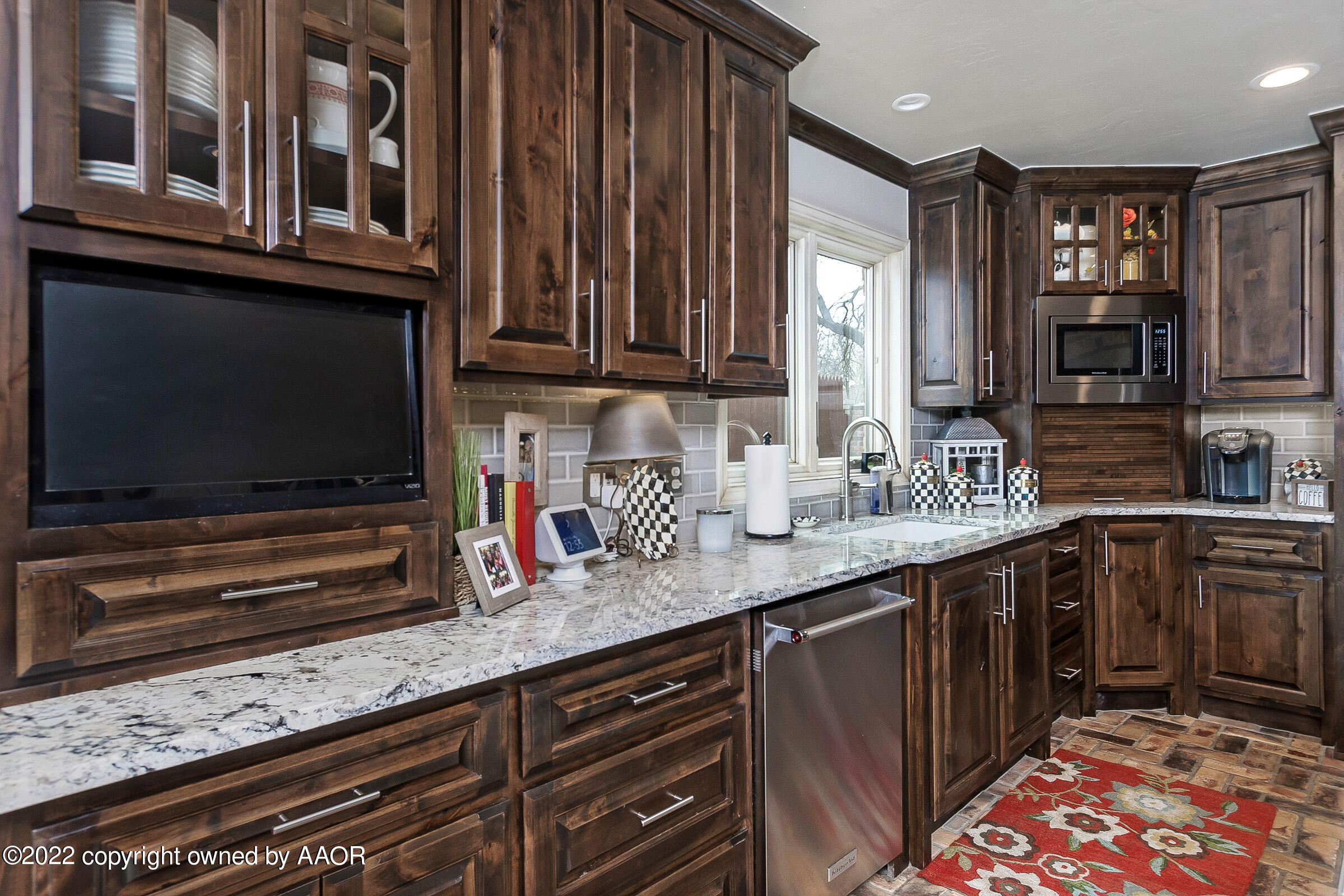 4223 Langtry Drive Amarillo, TX 79109 - Photo 4 of 56 a kitchen with stainless steel appliances kitchen island granite countertop a sink stove and cabinets