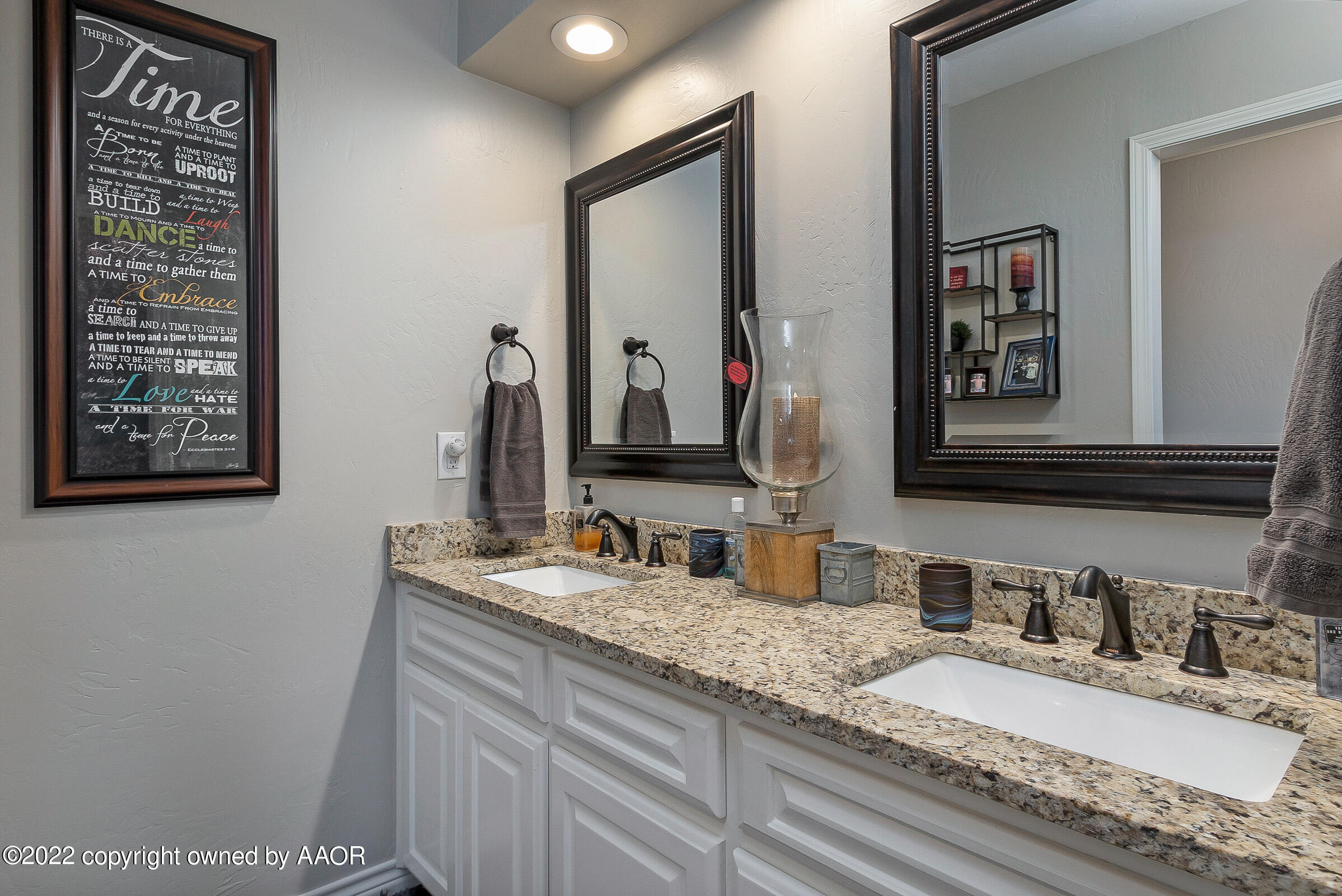 4223 Langtry Drive Amarillo, TX 79109 - Photo 43 of 56 a bathroom with double vanity sinks and a mirror