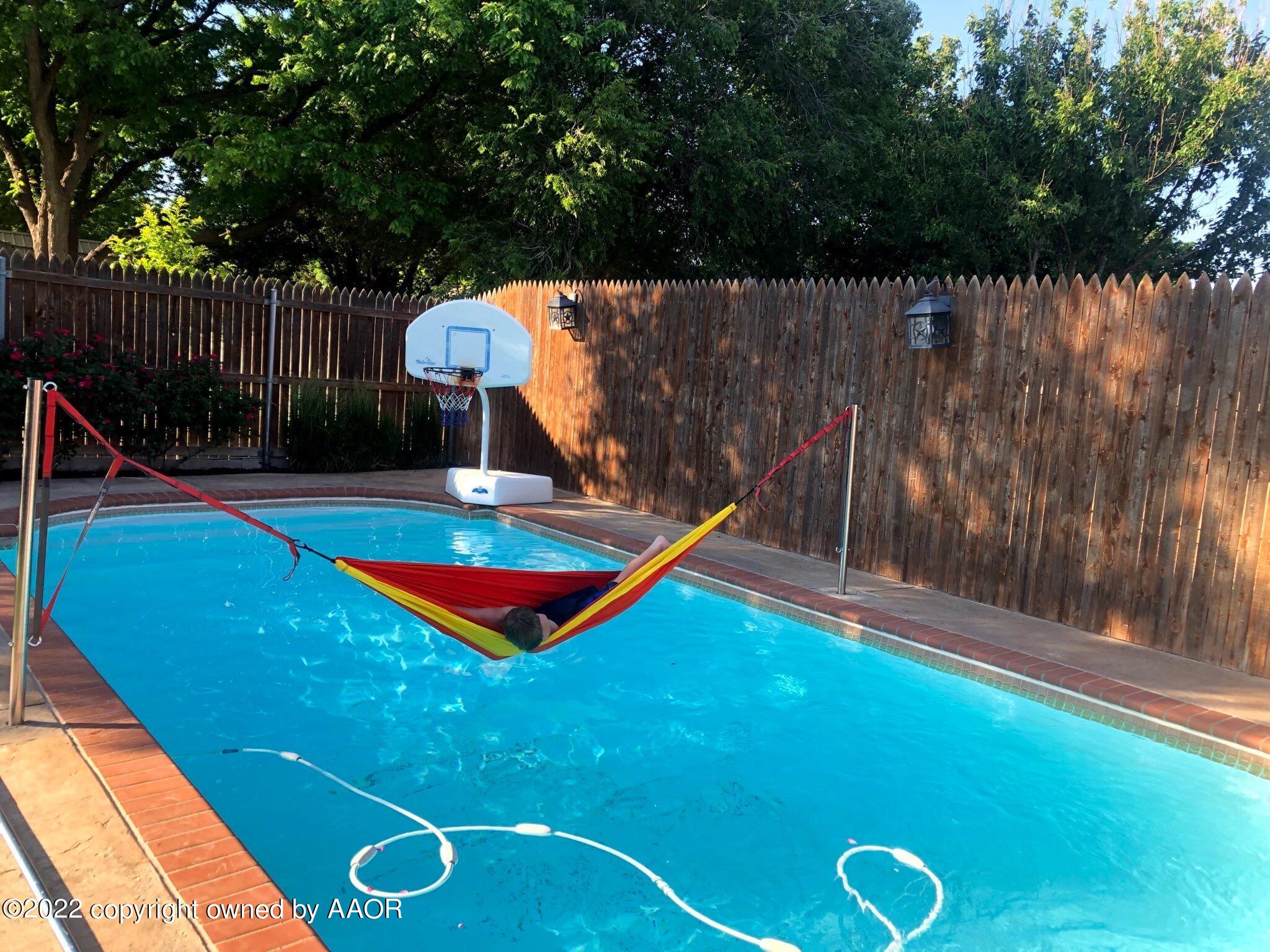 4223 Langtry Drive Amarillo, TX 79109 - Photo 56 of 56 a view of swimming pool with a backyard and a slide
