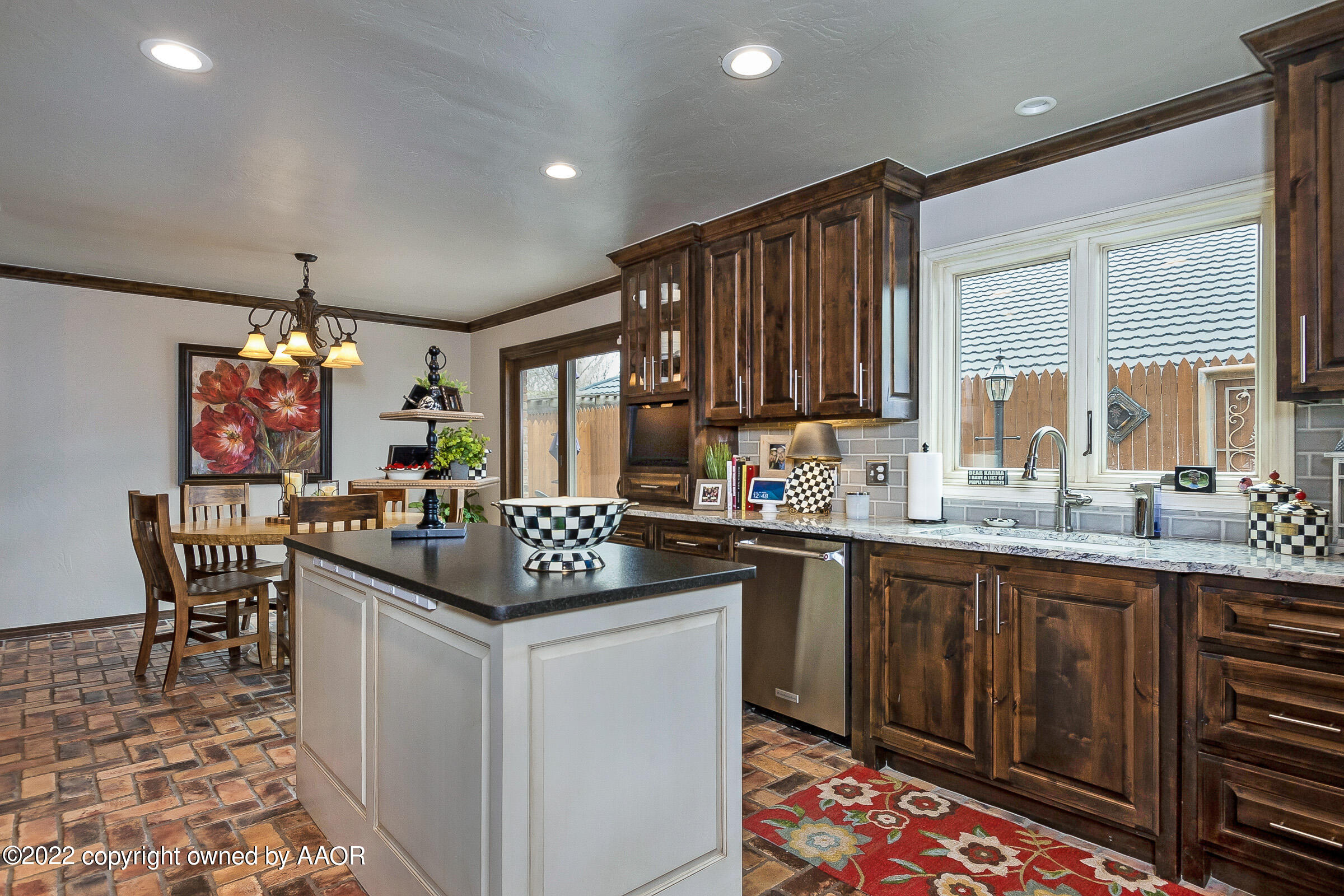 4223 Langtry Drive Amarillo, TX 79109 - Photo 6 of 56 a kitchen with granite countertop a sink stove and cabinets