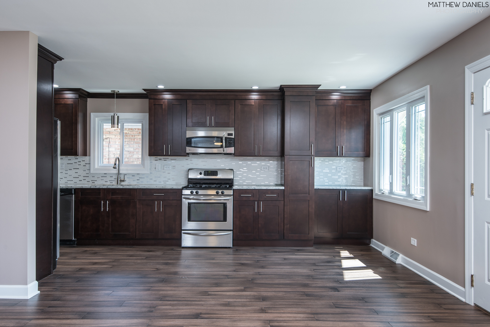 5208 State Road Burbank, IL 60459 - Photo 2 of 21 a kitchen with stainless steel appliances granite countertop a stove a sink and a refrigerator