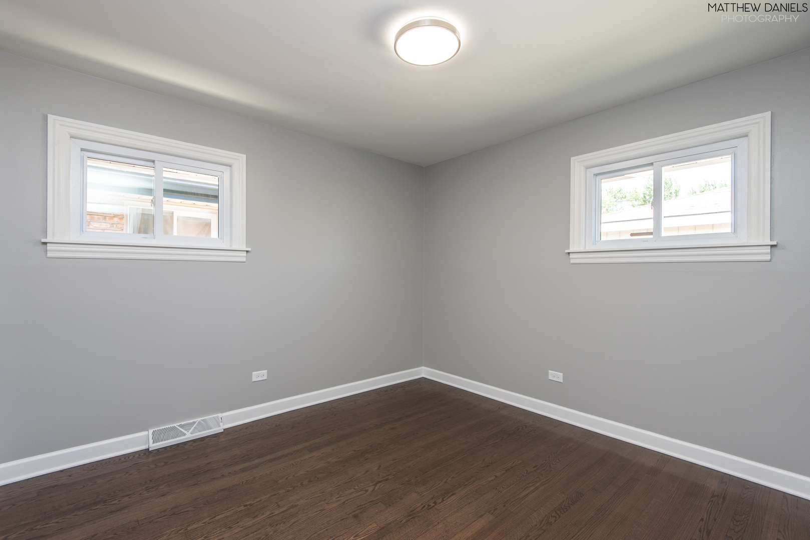 5208 State Road Burbank, IL 60459 - Photo 12 of 21 an empty room with wooden floor and windows