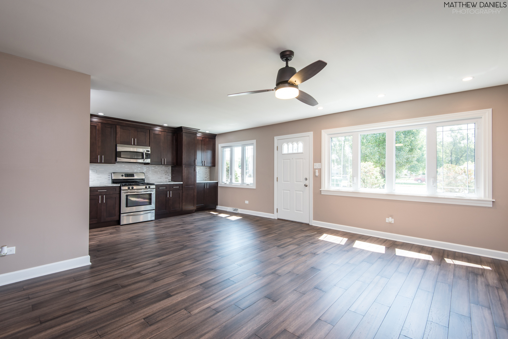 5208 State Road Burbank, IL 60459 - Photo 6 of 21 a view of kitchen with sink a microwave and wooden floor
