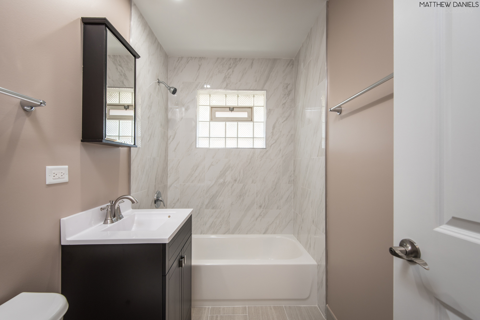 5208 State Road Burbank, IL 60459 - Photo 9 of 21 a bathroom with a sink toilet and shower
