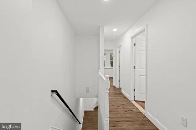 a view of a hallway with the wooden floor