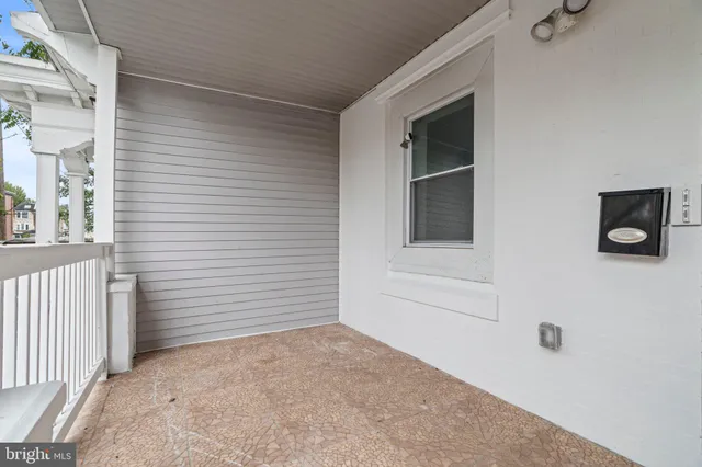 a view of an empty room with windows