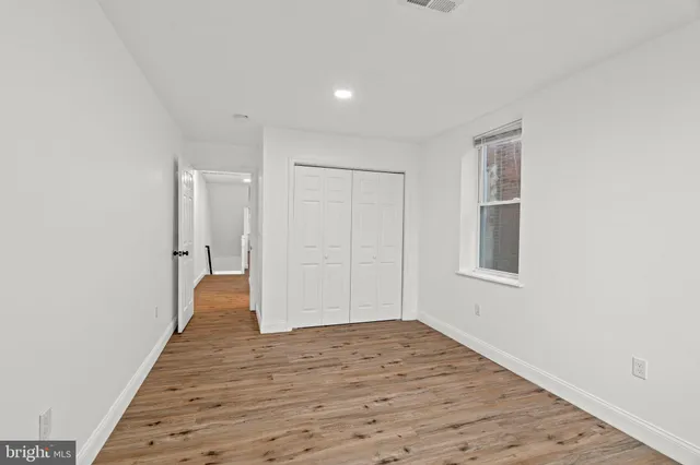 a view of a room with wooden floor and stairs