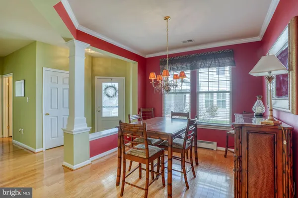 a view of a livingroom with furniture window and wooden floor