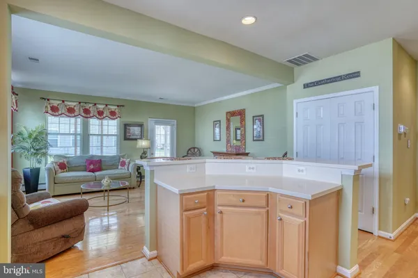 a kitchen with a stove a sink and a refrigerator