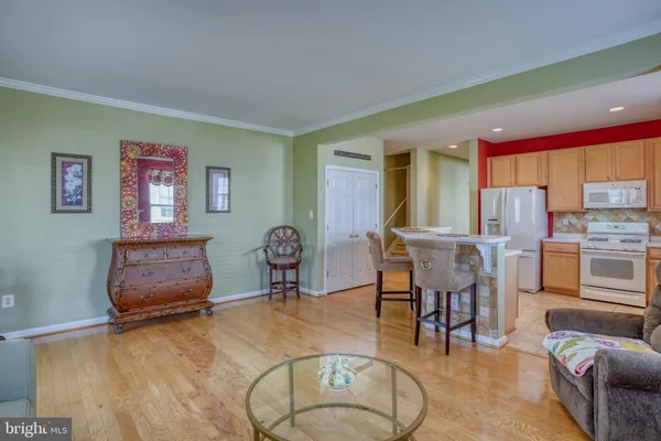 a bedroom with a bed dresser and a window