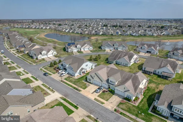 an aerial view of a house with a lake view