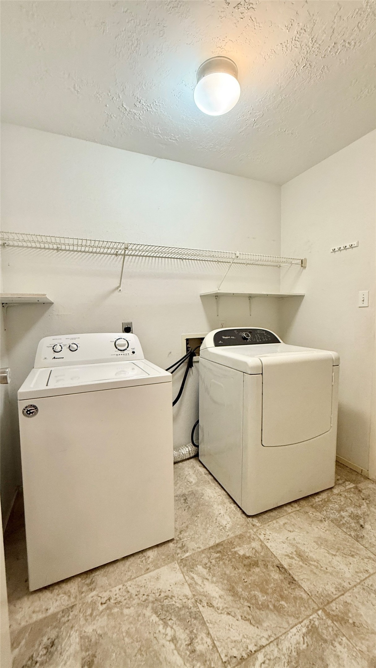 18 Dellforest Court Spring, TX 77381 - Photo 11 of 42 a utility room with dryer and washer