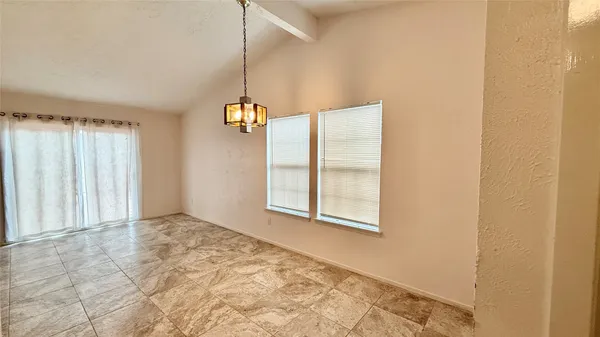en view of an empty room with a window
