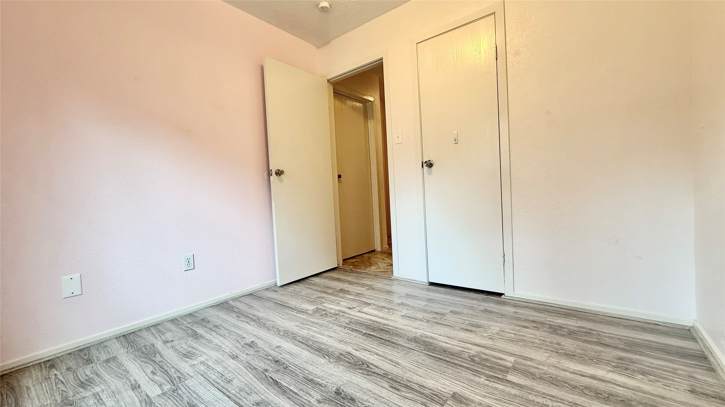 18 Dellforest Court Spring, TX 77381 - Photo 18 of 42 a view of an empty room with wooden floor