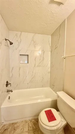 a bathroom with a bathtub and sink