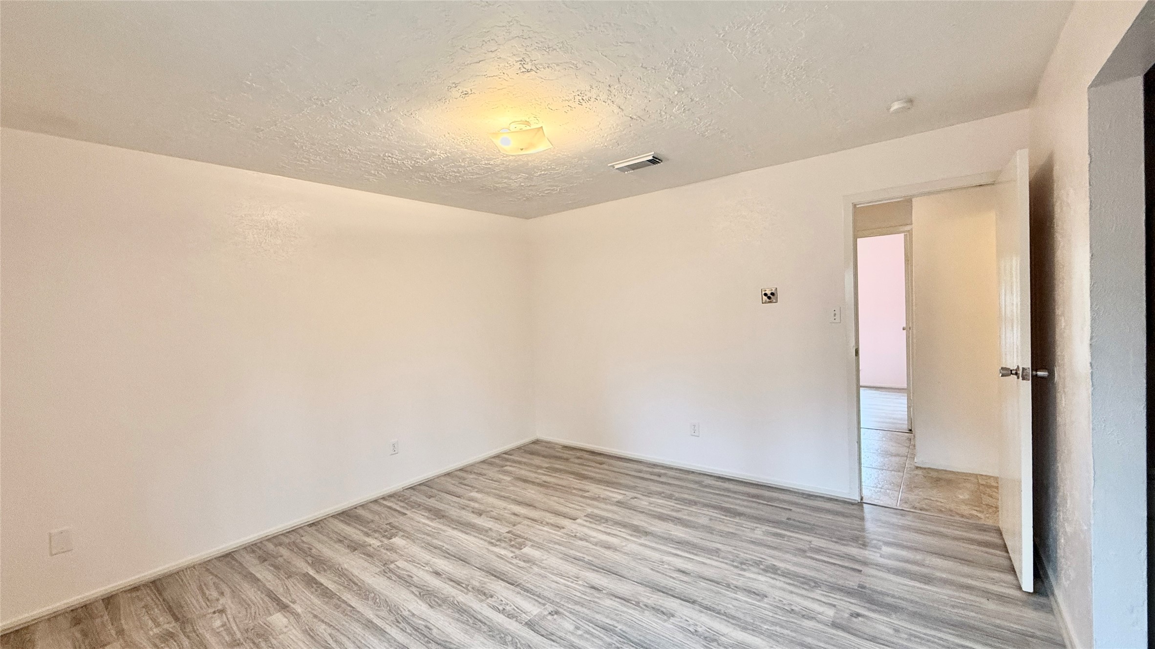 18 Dellforest Court Spring, TX 77381 - Photo 22 of 42 a view of empty room with wooden floor