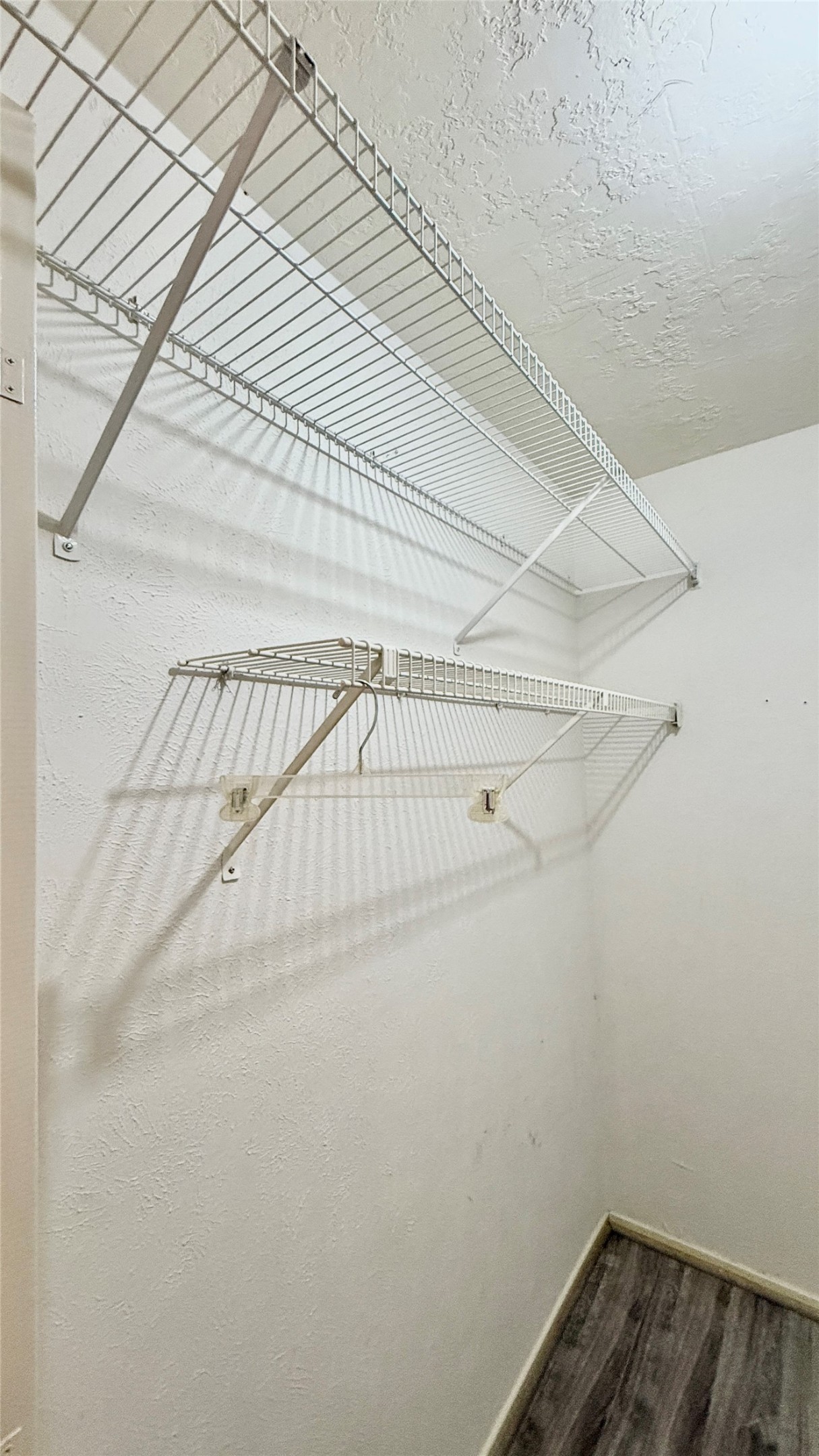 18 Dellforest Court Spring, TX 77381 - Photo 23 of 42 a view of a room with racks on the wall