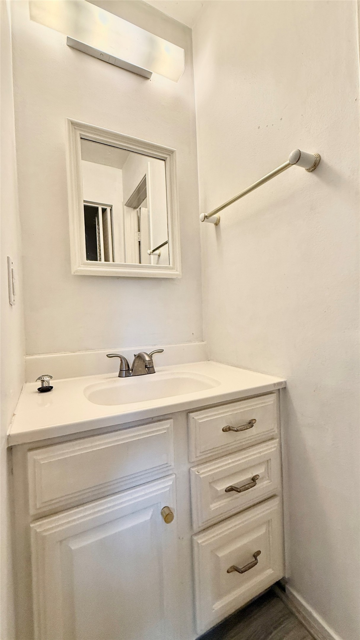 18 Dellforest Court Spring, TX 77381 - Photo 27 of 42 a bathroom with a sink and a mirror