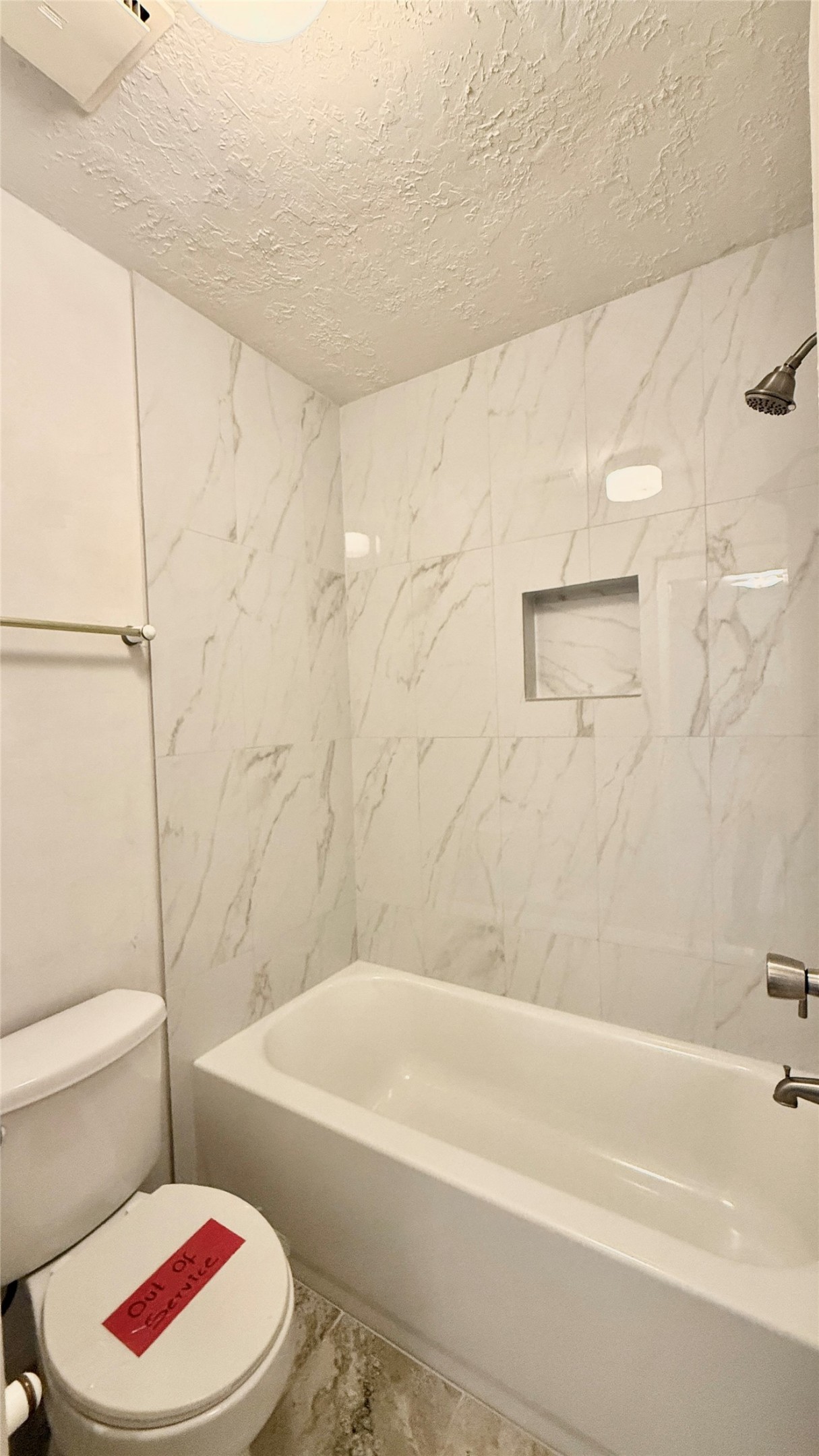 18 Dellforest Court Spring, TX 77381 - Photo 28 of 42 a white bath tub sitting next to a white toilet