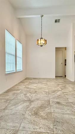 a room with a wooden floor and sink