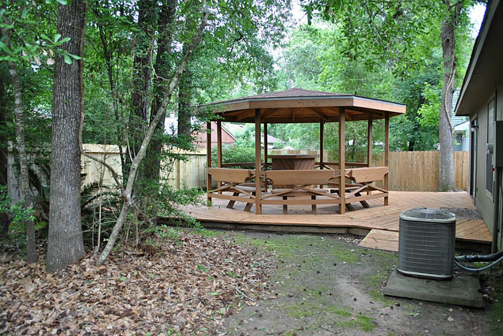 18 Dellforest Court Spring, TX 77381 - Photo 40 of 42 a view of a chair and table in backyard