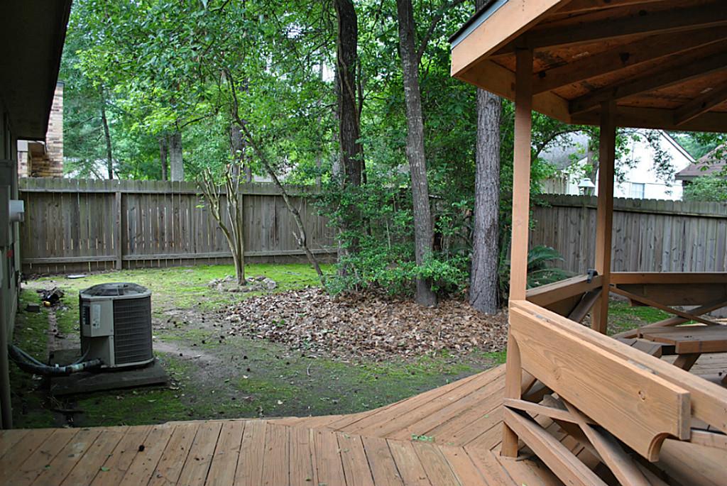 18 Dellforest Court Spring, TX 77381 - Photo 41 of 42 a view of backyard with green space and seating