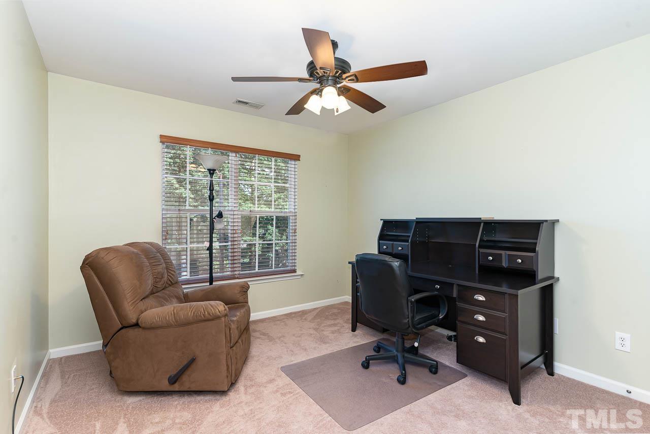 1605 October Road Raleigh, NC 27614 - Photo 29 of 31 a view of a livingroom with workspace and a window