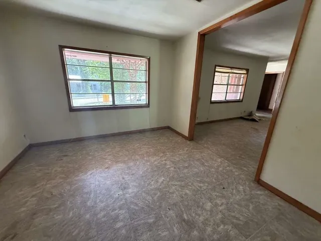 an empty room with windows