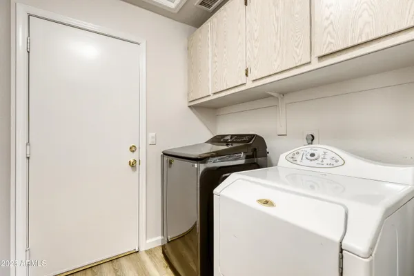 a utility room with dryer and washer