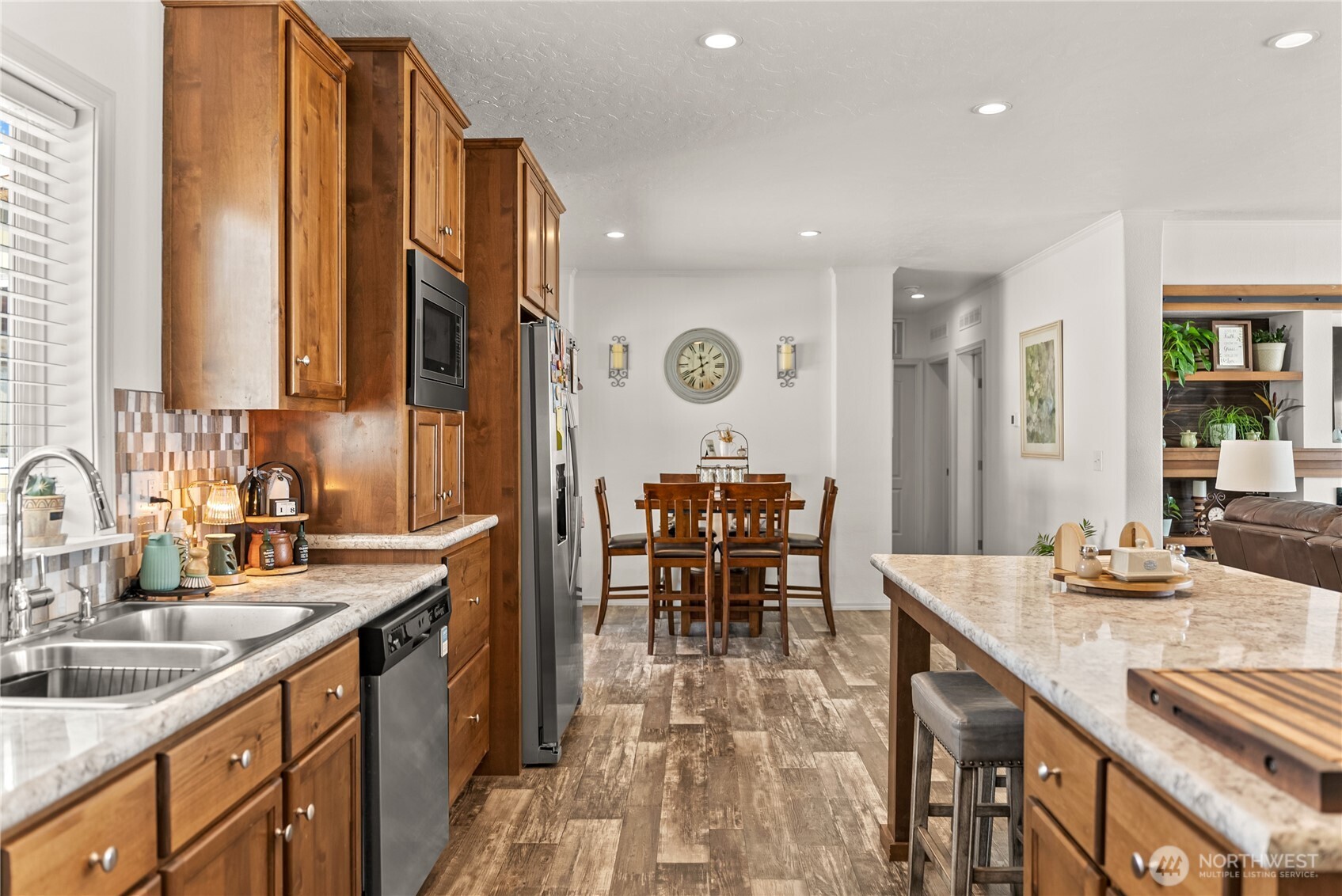 60 Alvarado Road Tonasket, WA 98855 - Photo 13 of 36 a kitchen with sink a counter and chairs