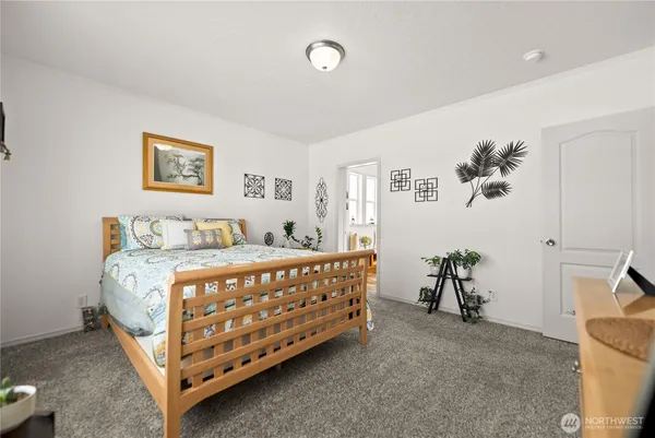 a bedroom with a bed and a table