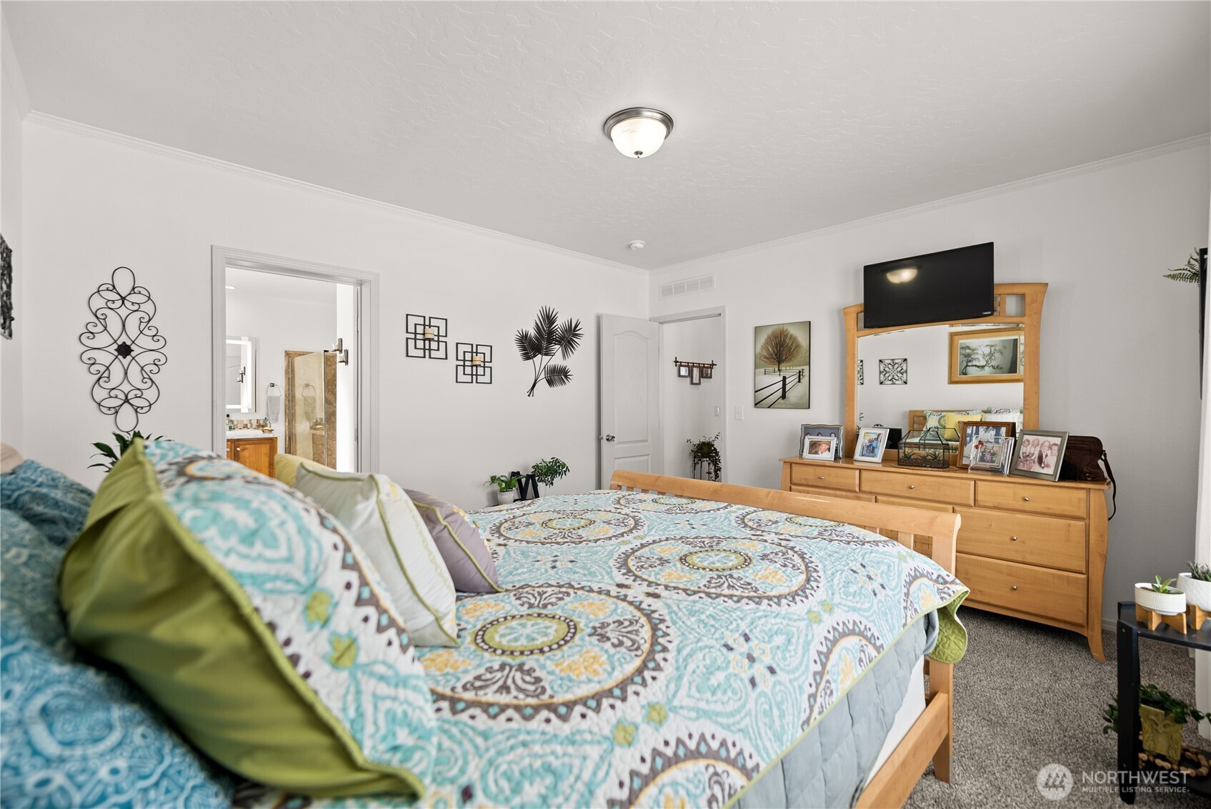 60 Alvarado Road Tonasket, WA 98855 - Photo 19 of 36 a bed room with a bed and a couch