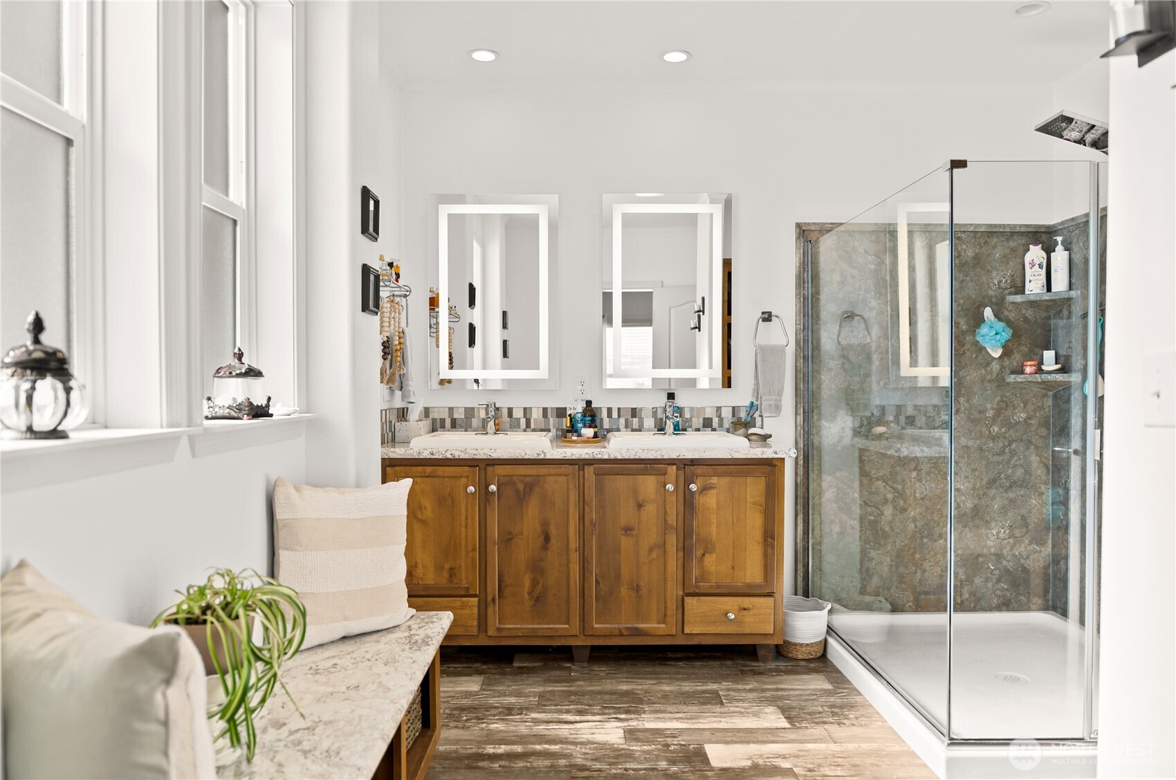 60 Alvarado Road Tonasket, WA 98855 - Photo 21 of 36 a bathroom with a granite countertop bathtub a mirror and a shower