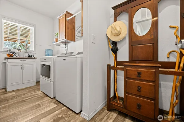 a view of a kitchen with washer and dryer