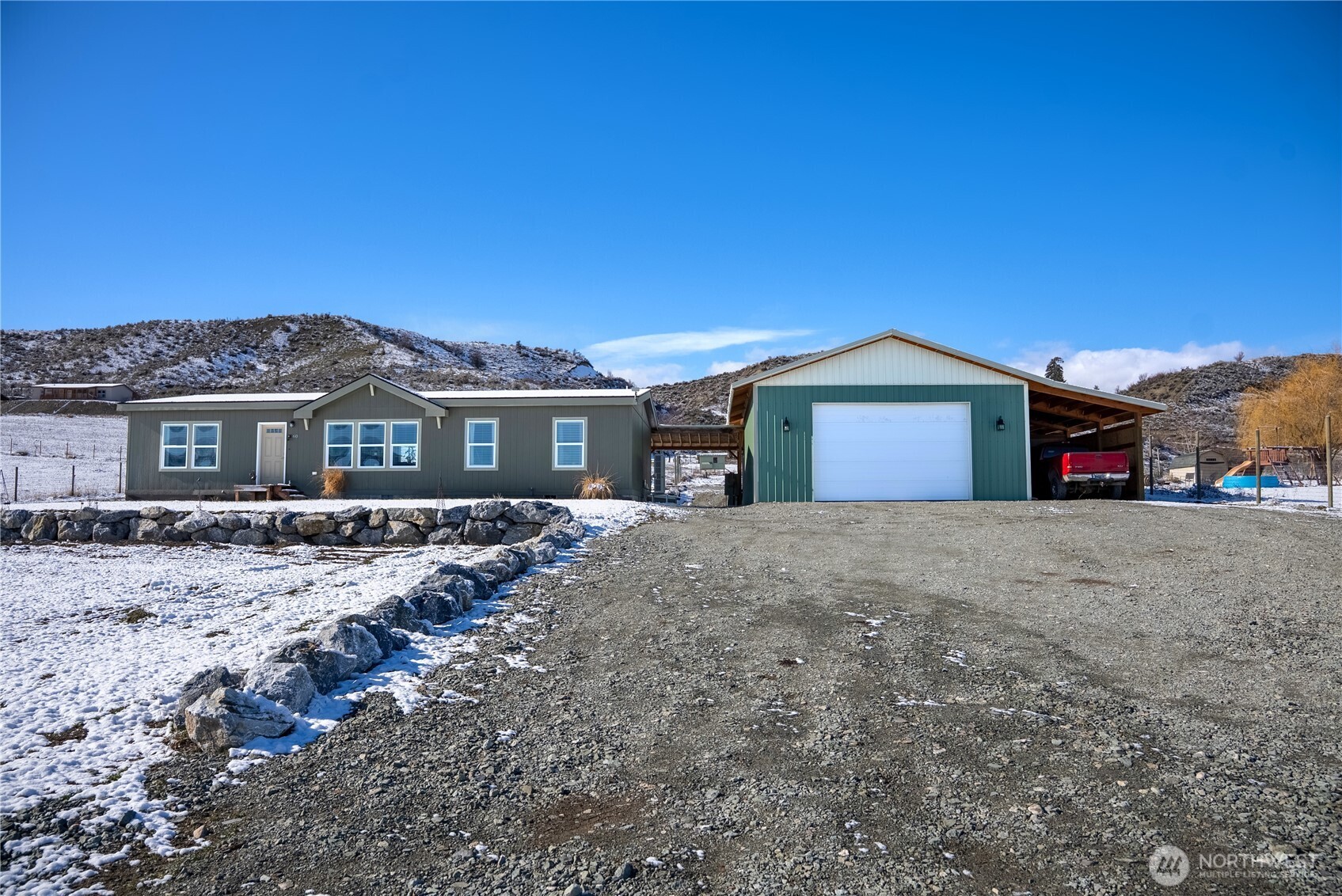 60 Alvarado Road Tonasket, WA 98855 - Photo 31 of 36 a front view of a house with a yard
