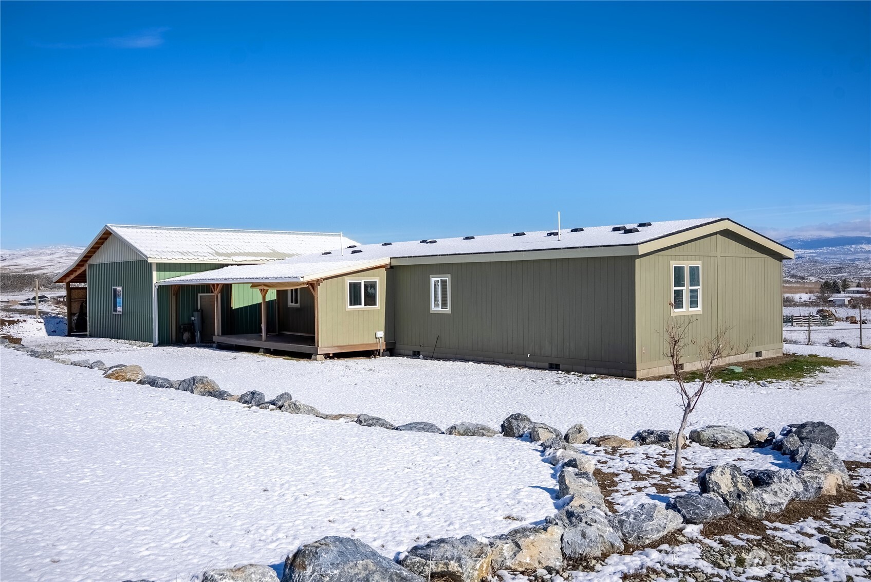 60 Alvarado Road Tonasket, WA 98855 - Photo 32 of 36 a front view of a house with a yard
