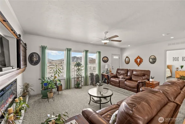 a living room with furniture and a large window