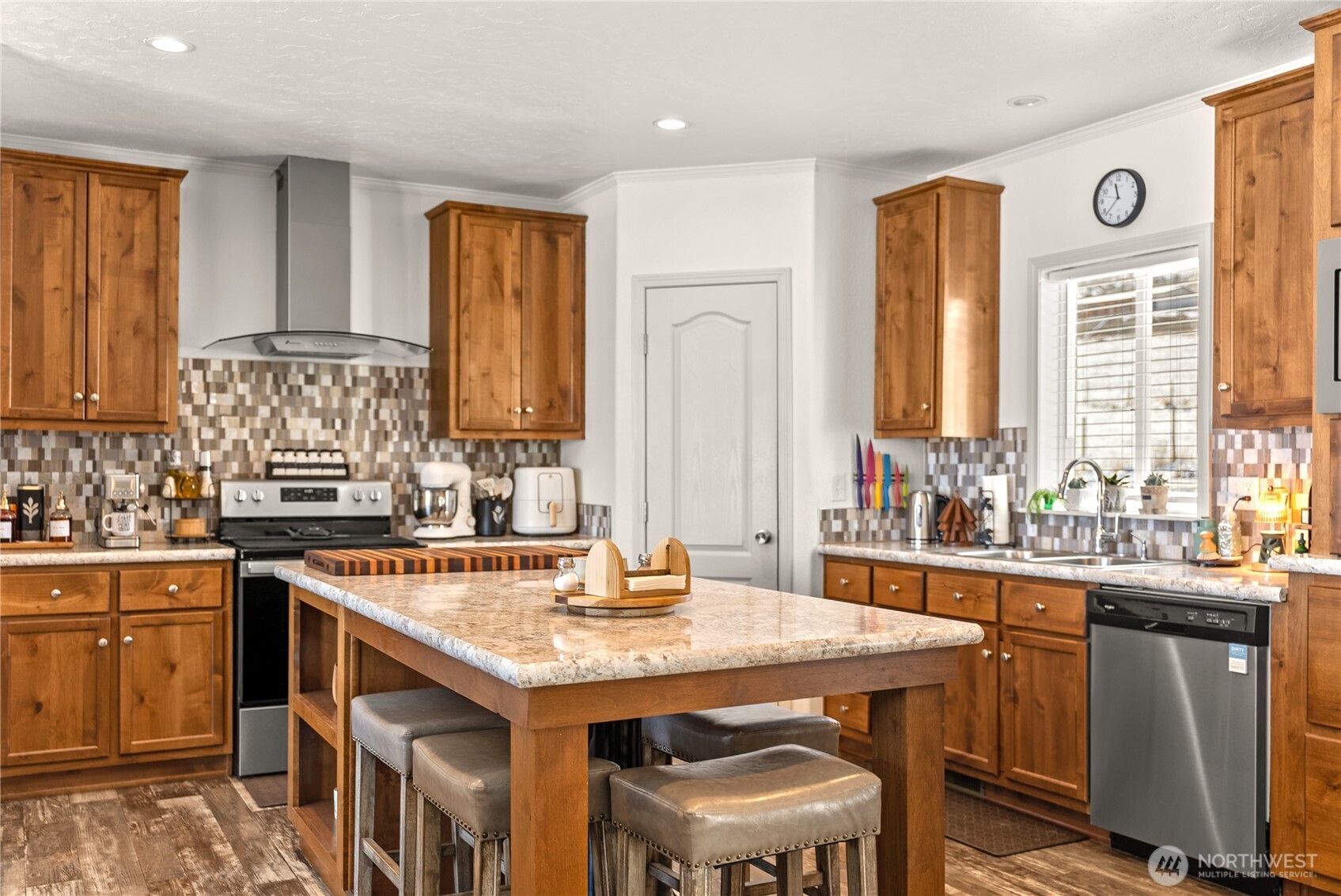 60 Alvarado Road Tonasket, WA 98855 - Photo 8 of 36 a kitchen with a stove a sink and a refrigerator
