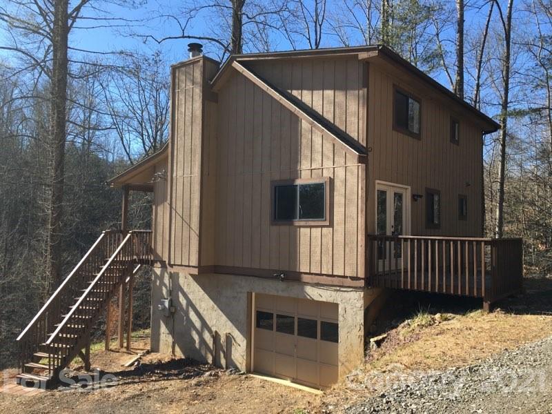 888 Rustic Heights Road Waynesville, NC 28785 - Photo 1 of 25 a view of house with a roof deck