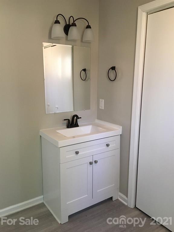 888 Rustic Heights Road Waynesville, NC 28785 - Photo 16 of 25 a bathroom with a sink and a mirror