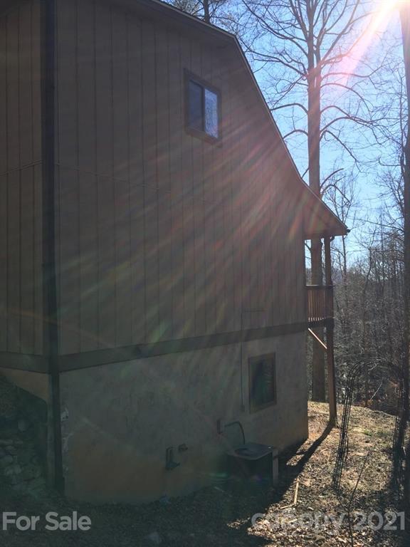 888 Rustic Heights Road Waynesville, NC 28785 - Photo 3 of 25 a backyard of a house