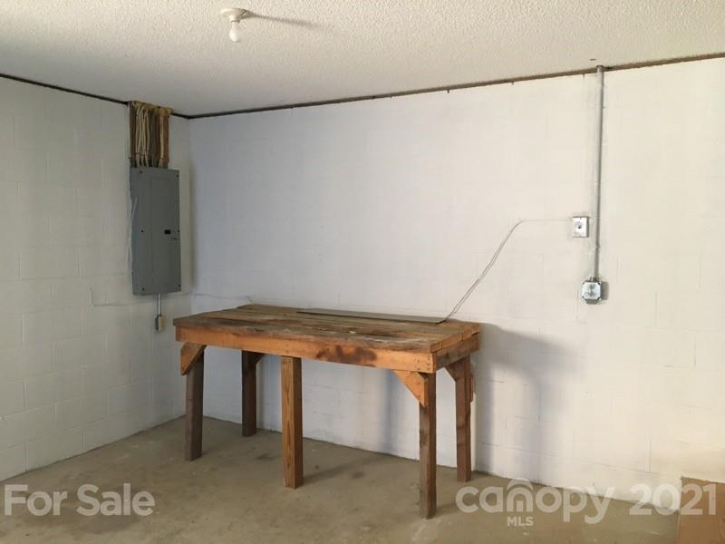 888 Rustic Heights Road Waynesville, NC 28785 - Photo 25 of 25 a room with storage and utility