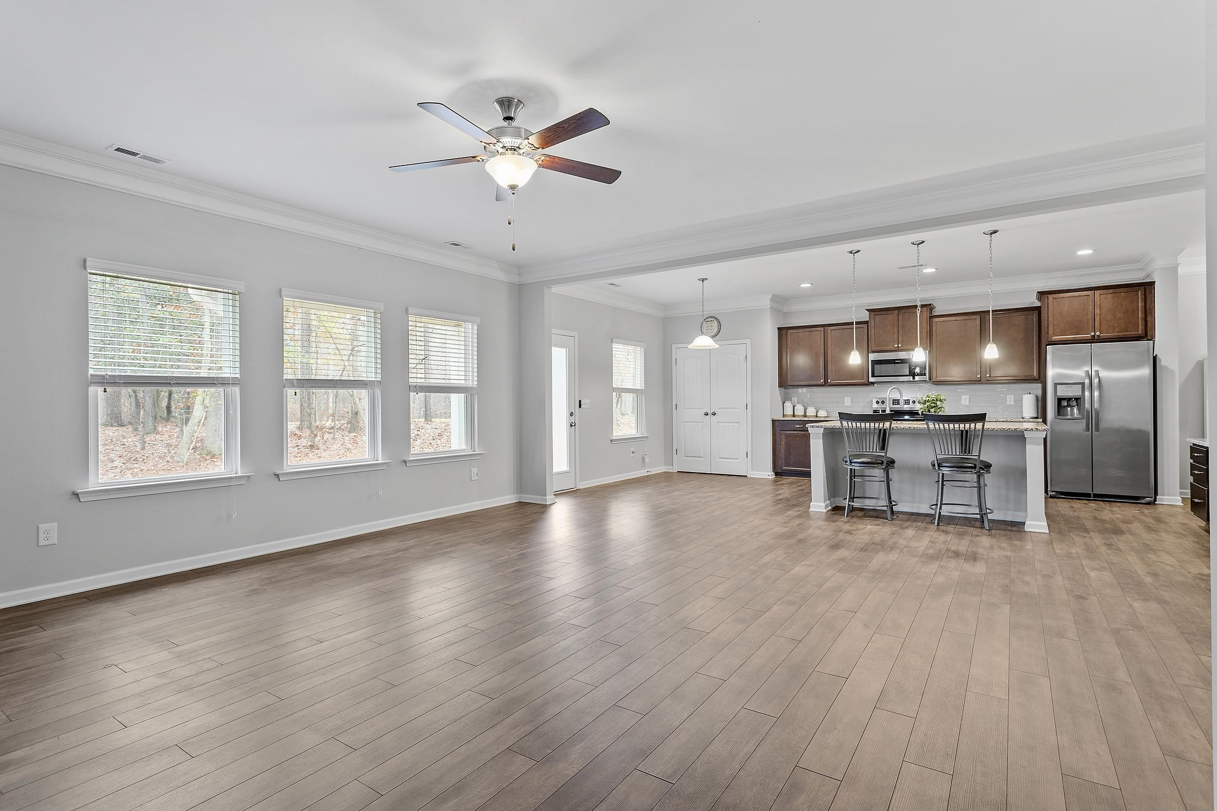 306 Springhill Lane Garner, NC 27529 - Photo 14 of 34 a view of kitchen with stove and wooden cabinets
