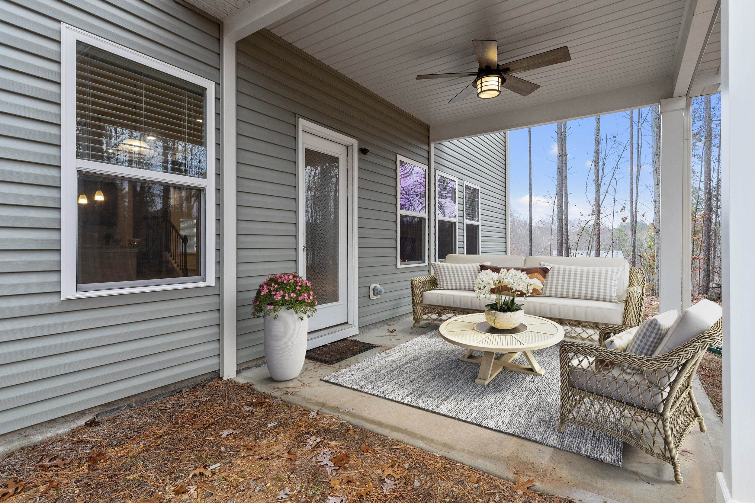 306 Springhill Lane Garner, NC 27529 - Photo 5 of 34 a building outdoor space with patio furniture and potted plants